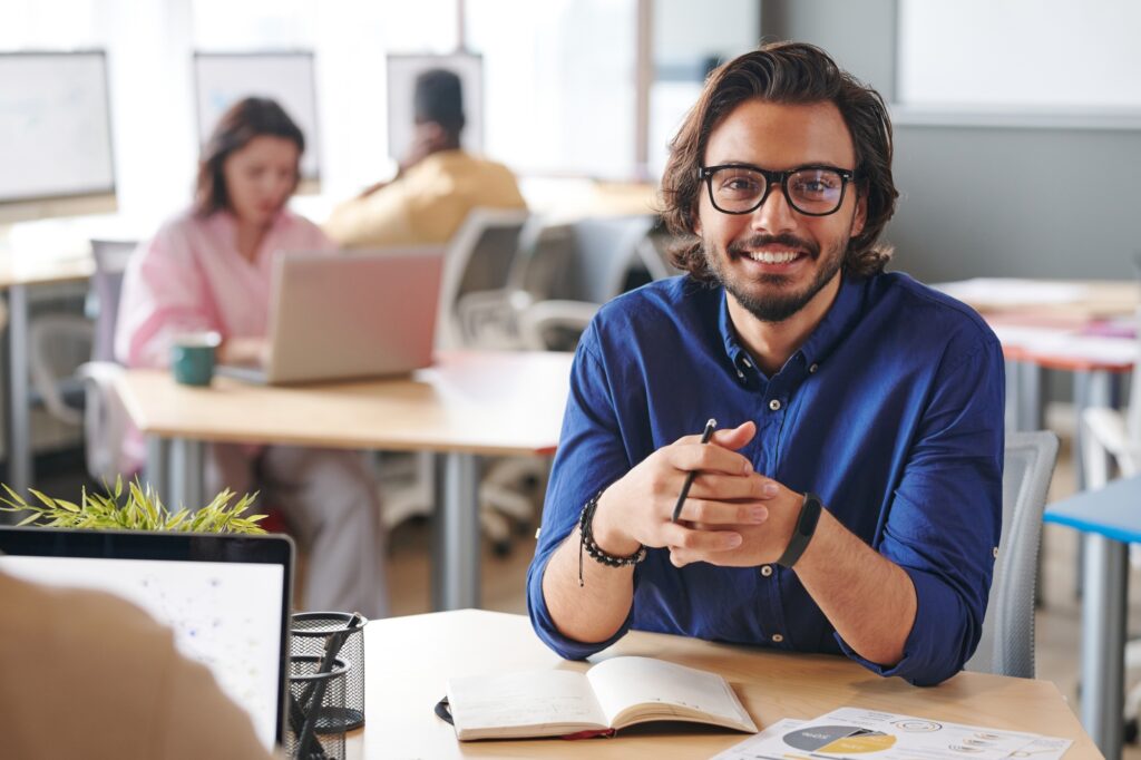 Portrait of successful marketing expert in office